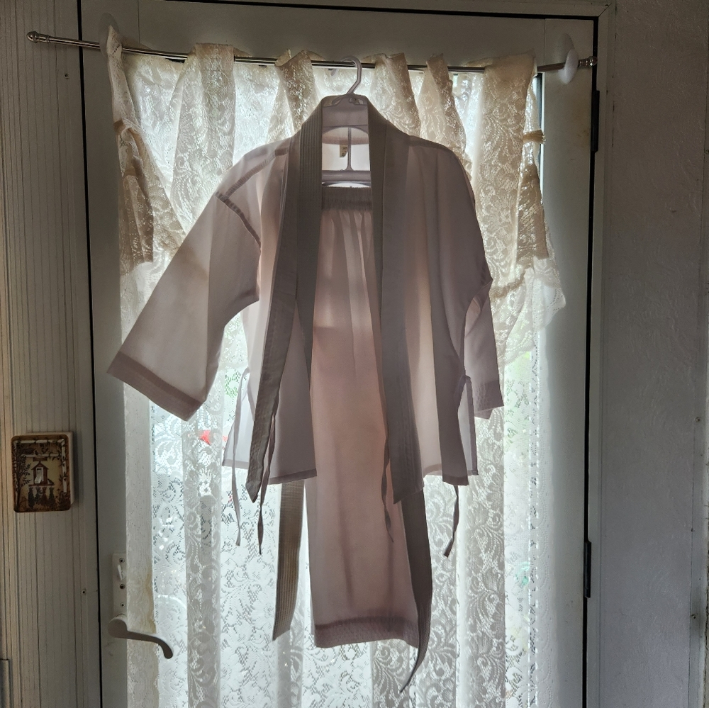 Boys size 0 karate uniform jacket with pants and belt.